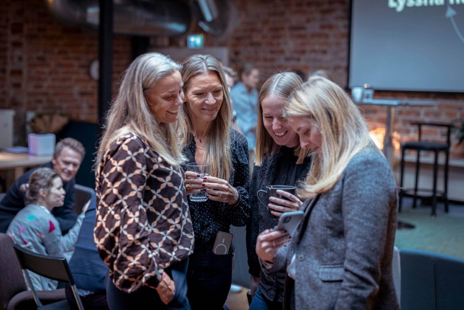 four women at a workplace